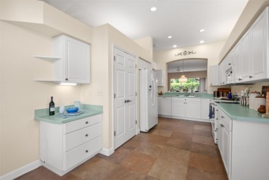 Walk up as you take in the lush landscape and brick paved front on East Lake Woodlands Country Club in Florida - for sale on GolfHomes.com, golf home, golf lot