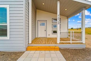 Experience modern country living with breathtaking mountain on Hollydot Golf Course in Colorado - for sale on GolfHomes.com, golf home, golf lot