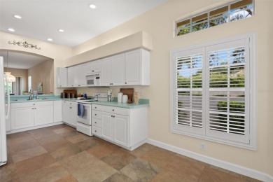 Walk up as you take in the lush landscape and brick paved front on East Lake Woodlands Country Club in Florida - for sale on GolfHomes.com, golf home, golf lot