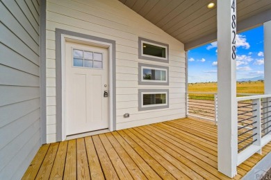 Experience modern country living with breathtaking mountain on Hollydot Golf Course in Colorado - for sale on GolfHomes.com, golf home, golf lot