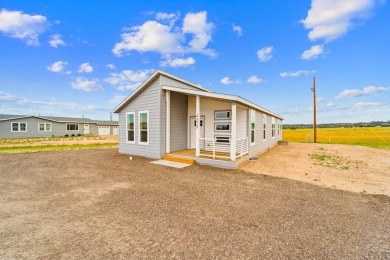 Experience modern country living with breathtaking mountain on Hollydot Golf Course in Colorado - for sale on GolfHomes.com, golf home, golf lot