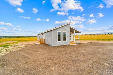 Experience modern country living with breathtaking mountain on Hollydot Golf Course in Colorado - for sale on GolfHomes.com, golf home, golf lot