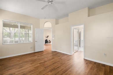 Walk up as you take in the lush landscape and brick paved front on East Lake Woodlands Country Club in Florida - for sale on GolfHomes.com, golf home, golf lot