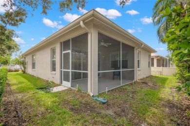 Walk up as you take in the lush landscape and brick paved front on East Lake Woodlands Country Club in Florida - for sale on GolfHomes.com, golf home, golf lot