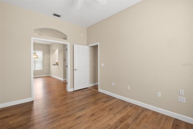 Walk up as you take in the lush landscape and brick paved front on East Lake Woodlands Country Club in Florida - for sale on GolfHomes.com, golf home, golf lot