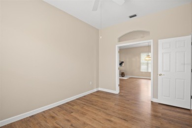 Walk up as you take in the lush landscape and brick paved front on East Lake Woodlands Country Club in Florida - for sale on GolfHomes.com, golf home, golf lot