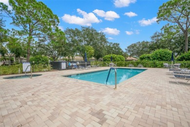 Walk up as you take in the lush landscape and brick paved front on East Lake Woodlands Country Club in Florida - for sale on GolfHomes.com, golf home, golf lot