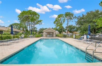 Walk up as you take in the lush landscape and brick paved front on East Lake Woodlands Country Club in Florida - for sale on GolfHomes.com, golf home, golf lot