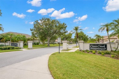 Walk up as you take in the lush landscape and brick paved front on East Lake Woodlands Country Club in Florida - for sale on GolfHomes.com, golf home, golf lot