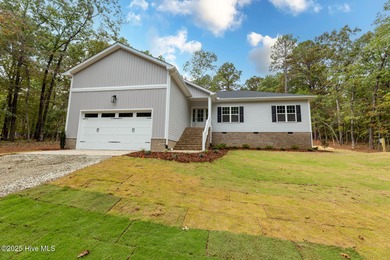 This newly built 4-bedroom, 2-bath home in the ever popular on Seven Lakes Country Club in North Carolina - for sale on GolfHomes.com, golf home, golf lot