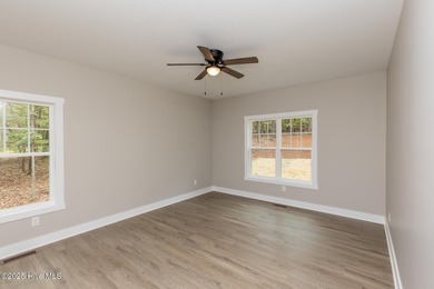 This newly built 4-bedroom, 2-bath home in the ever popular on Seven Lakes Country Club in North Carolina - for sale on GolfHomes.com, golf home, golf lot