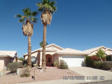 Fairway Estates home, with front landscaping and mature palm on Desert Lakes Golf Course in Arizona - for sale on GolfHomes.com, golf home, golf lot