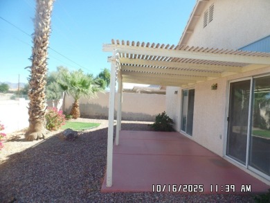 Fairway Estates home, with front landscaping and mature palm on Desert Lakes Golf Course in Arizona - for sale on GolfHomes.com, golf home, golf lot