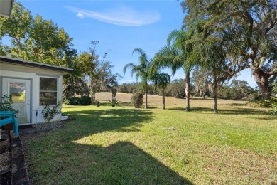 Discover your peaceful retreat in this charming two-bedroom on Sun Air Golf Course in Florida - for sale on GolfHomes.com, golf home, golf lot