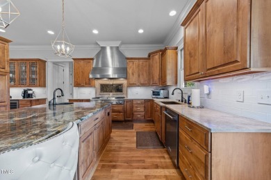 This 4 bedroom, 4 and a half-bath home offers over 170 feet of on TPC at Wakefield Plantation in North Carolina - for sale on GolfHomes.com, golf home, golf lot