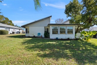 Discover your peaceful retreat in this charming two-bedroom on Sun Air Golf Course in Florida - for sale on GolfHomes.com, golf home, golf lot