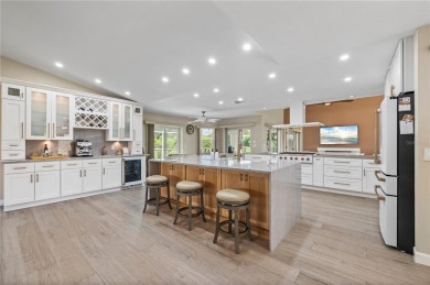 Some homes have rooms. This one has destinations-a kitchen built on Deep Creek Golf Club in Florida - for sale on GolfHomes.com, golf home, golf lot