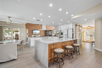 Some homes have rooms. This one has destinations-a kitchen built on Deep Creek Golf Club in Florida - for sale on GolfHomes.com, golf home, golf lot