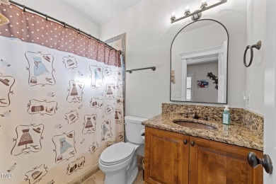 This 4 bedroom, 4 and a half-bath home offers over 170 feet of on TPC at Wakefield Plantation in North Carolina - for sale on GolfHomes.com, golf home, golf lot