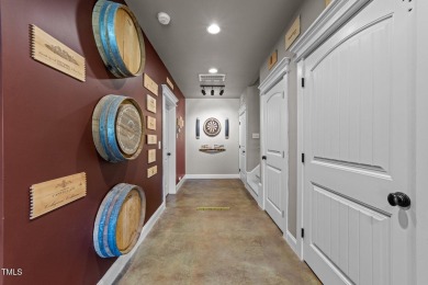 This 4 bedroom, 4 and a half-bath home offers over 170 feet of on TPC at Wakefield Plantation in North Carolina - for sale on GolfHomes.com, golf home, golf lot