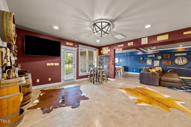 This 4 bedroom, 4 and a half-bath home offers over 170 feet of on TPC at Wakefield Plantation in North Carolina - for sale on GolfHomes.com, golf home, golf lot