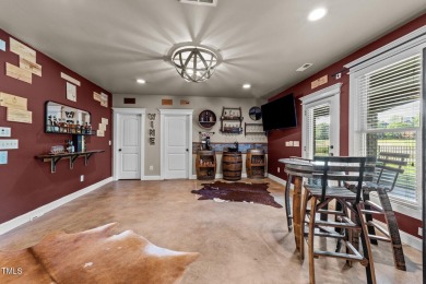 This 4 bedroom, 4 and a half-bath home offers over 170 feet of on TPC at Wakefield Plantation in North Carolina - for sale on GolfHomes.com, golf home, golf lot