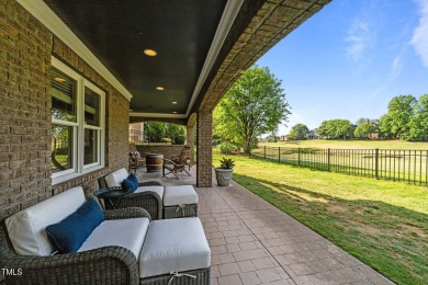 This 4 bedroom, 4 and a half-bath home offers over 170 feet of on TPC at Wakefield Plantation in North Carolina - for sale on GolfHomes.com, golf home, golf lot