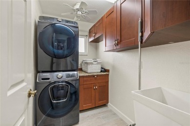 Some homes have rooms. This one has destinations-a kitchen built on Deep Creek Golf Club in Florida - for sale on GolfHomes.com, golf home, golf lot