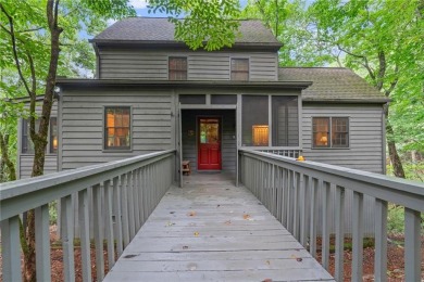 Discover the perfect mountain escape in this charming 3-bedroom on Big Canoe Golf Club - Cherokee in Georgia - for sale on GolfHomes.com, golf home, golf lot