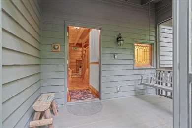 Discover the perfect mountain escape in this charming 3-bedroom on Big Canoe Golf Club - Cherokee in Georgia - for sale on GolfHomes.com, golf home, golf lot