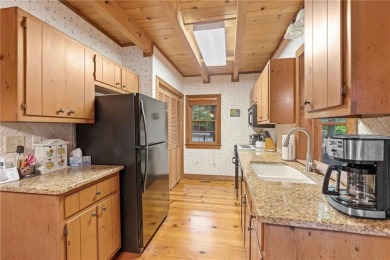 Discover the perfect mountain escape in this charming 3-bedroom on Big Canoe Golf Club - Cherokee in Georgia - for sale on GolfHomes.com, golf home, golf lot