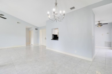 Welcome home to 5695 Lakeview Mews Drive in the heart of Boynton on Indian Spring Golf and Country Club in Florida - for sale on GolfHomes.com, golf home, golf lot