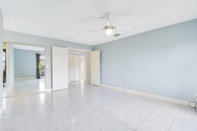 Welcome home to 5695 Lakeview Mews Drive in the heart of Boynton on Indian Spring Golf and Country Club in Florida - for sale on GolfHomes.com, golf home, golf lot
