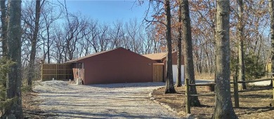 Welcome home to this picturesque setting with views for miles in on Linn Valley Lakes - Deer Trace Golf Course in Kansas - for sale on GolfHomes.com, golf home, golf lot