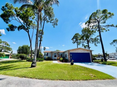 This two-bedroom, two-bathroom home in the gated golf community on Pine Lakes Country Club in Florida - for sale on GolfHomes.com, golf home, golf lot
