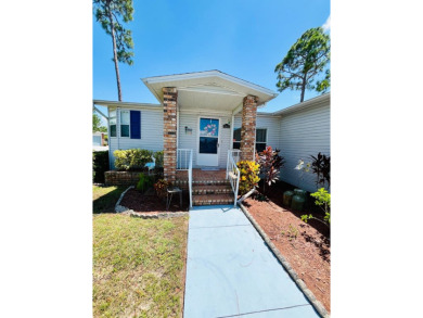 This two-bedroom, two-bathroom home in the gated golf community on Pine Lakes Country Club in Florida - for sale on GolfHomes.com, golf home, golf lot