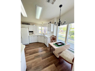 This two-bedroom, two-bathroom home in the gated golf community on Pine Lakes Country Club in Florida - for sale on GolfHomes.com, golf home, golf lot