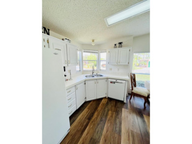 This two-bedroom, two-bathroom home in the gated golf community on Pine Lakes Country Club in Florida - for sale on GolfHomes.com, golf home, golf lot