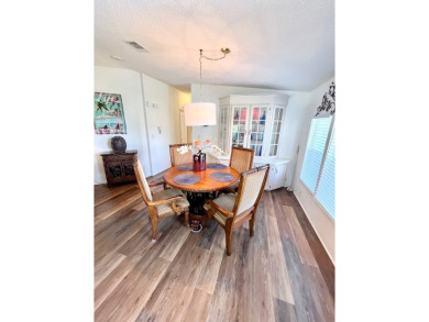 This two-bedroom, two-bathroom home in the gated golf community on Pine Lakes Country Club in Florida - for sale on GolfHomes.com, golf home, golf lot