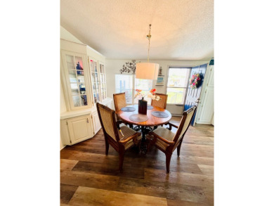 This two-bedroom, two-bathroom home in the gated golf community on Pine Lakes Country Club in Florida - for sale on GolfHomes.com, golf home, golf lot