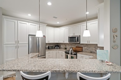 Enjoy this unfurnished luxury condo with 9' ceilings, granite on Members Club At St. James Plantation in North Carolina - for sale on GolfHomes.com, golf home, golf lot