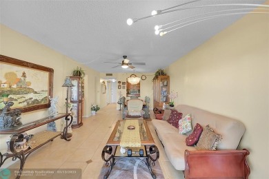 Top floor, corner unit featuring stunning views of the Golf on Boca Dunes Golf and Country Club in Florida - for sale on GolfHomes.com, golf home, golf lot