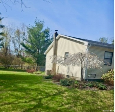 A sun-filled retreat, ready to meet its new owners! Peacefully on Mc Cann Memorial Golf Course in New York - for sale on GolfHomes.com, golf home, golf lot