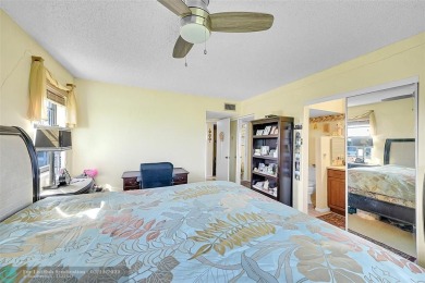 Top floor, corner unit featuring stunning views of the Golf on Boca Dunes Golf and Country Club in Florida - for sale on GolfHomes.com, golf home, golf lot