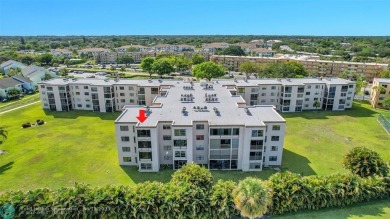 Top floor, corner unit featuring stunning views of the Golf on Boca Dunes Golf and Country Club in Florida - for sale on GolfHomes.com, golf home, golf lot