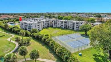 Top floor, corner unit featuring stunning views of the Golf on Boca Dunes Golf and Country Club in Florida - for sale on GolfHomes.com, golf home, golf lot