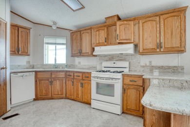 Charming 2-bedroom, 2-bath manufactured home in Palm Desert's on Portola Country Club in California - for sale on GolfHomes.com, golf home, golf lot