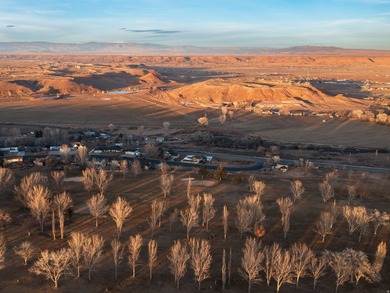 Imagine coming home to wide-open skies, mountain views, and the on Roosevelt Municipal Golf Course in Utah - for sale on GolfHomes.com, golf home, golf lot