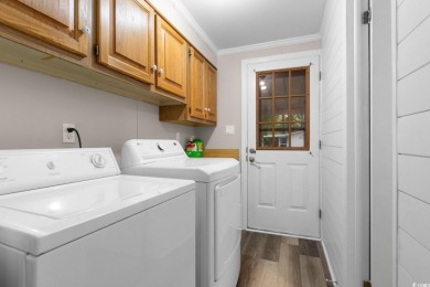 Welcome to 3093 Palmetto Drive, a beautifully updated 3-bedroom on Indigo Creek Golf Club in South Carolina - for sale on GolfHomes.com, golf home, golf lot