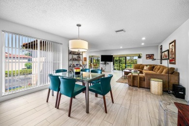 Enjoy beautiful golf course views from this bright and airy on  in Florida - for sale on GolfHomes.com, golf home, golf lot